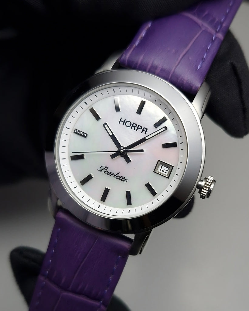 Women's stainless steel mother of pearl dial watch with a purple leather strap 